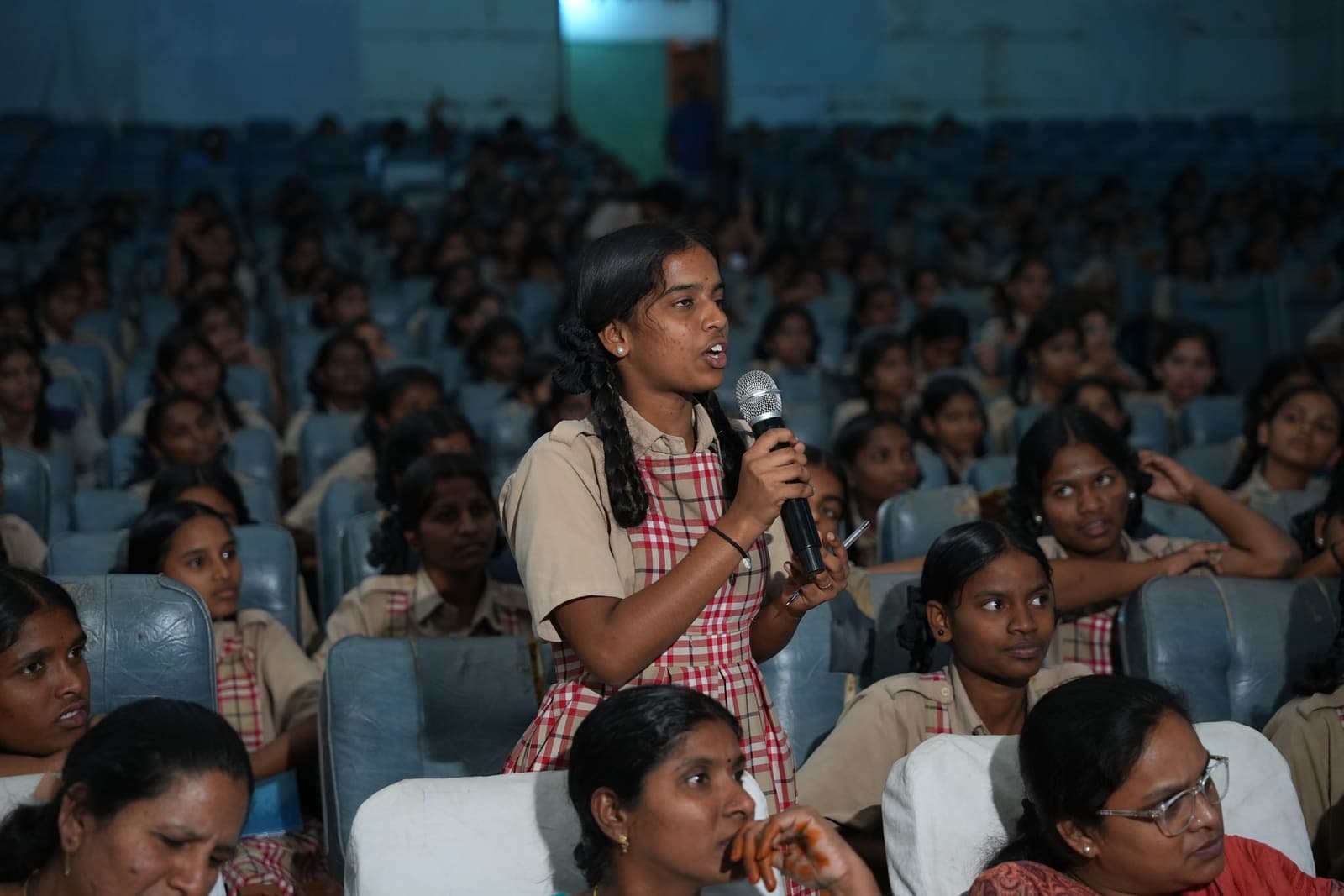 A student asks a question during a menstrual health session at a government school in Siddipet
